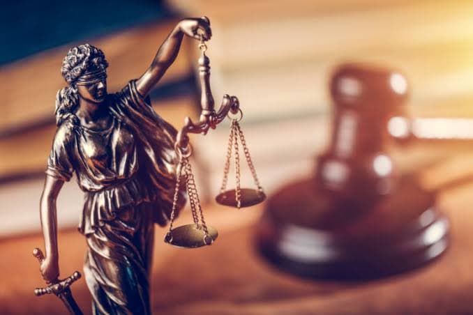 Statue of Lady Justice holding scales